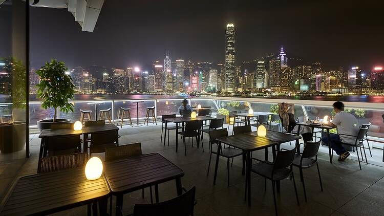 The Orient — outdoor terrace overlooking the Hong Kong skyline across Victoria Harbour